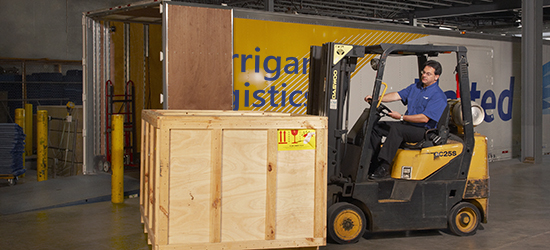 Project management warehouse worker using forklift