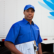 White glove delivery employee with clipboard